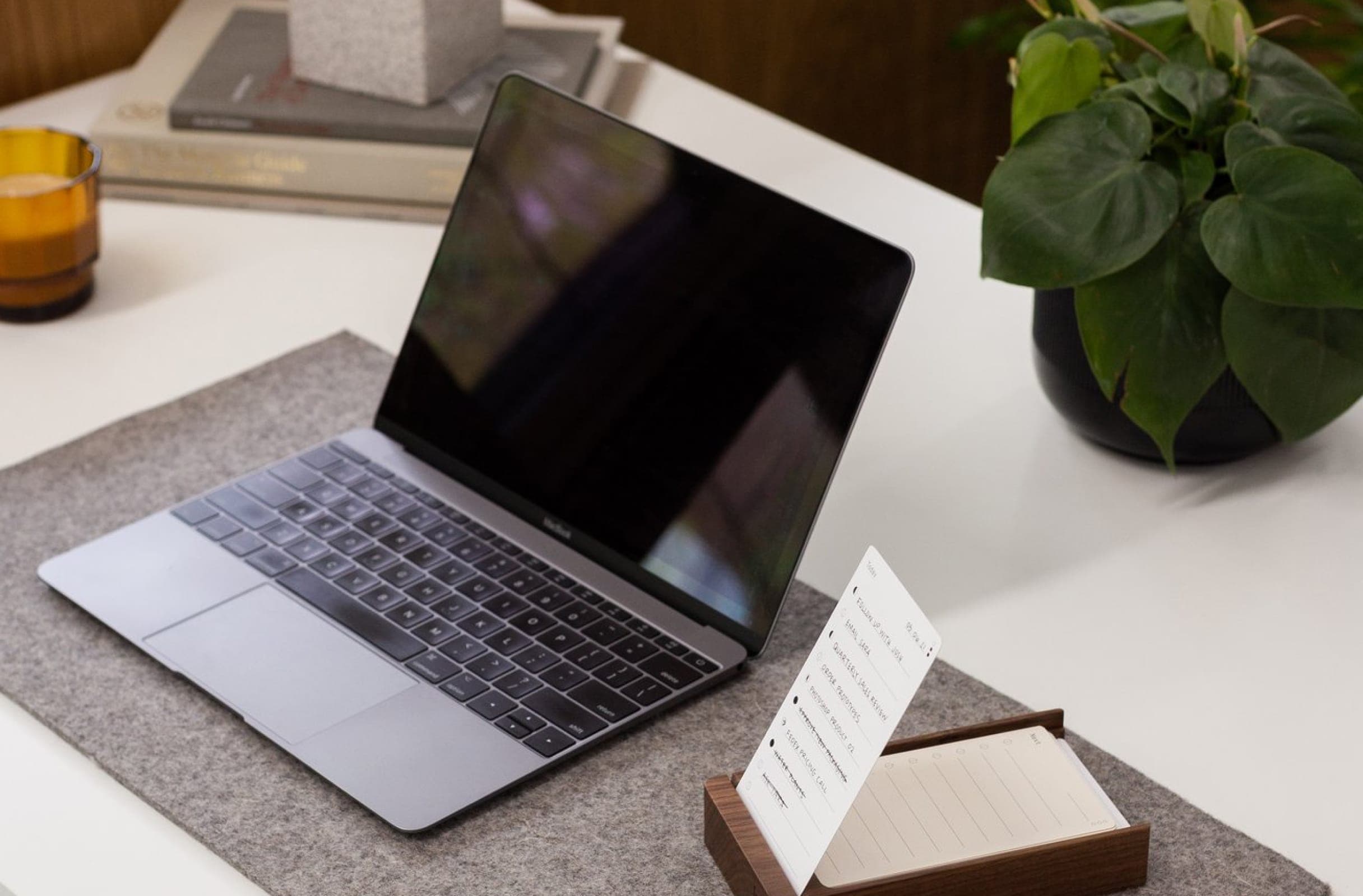Laptop on desk with todo list.